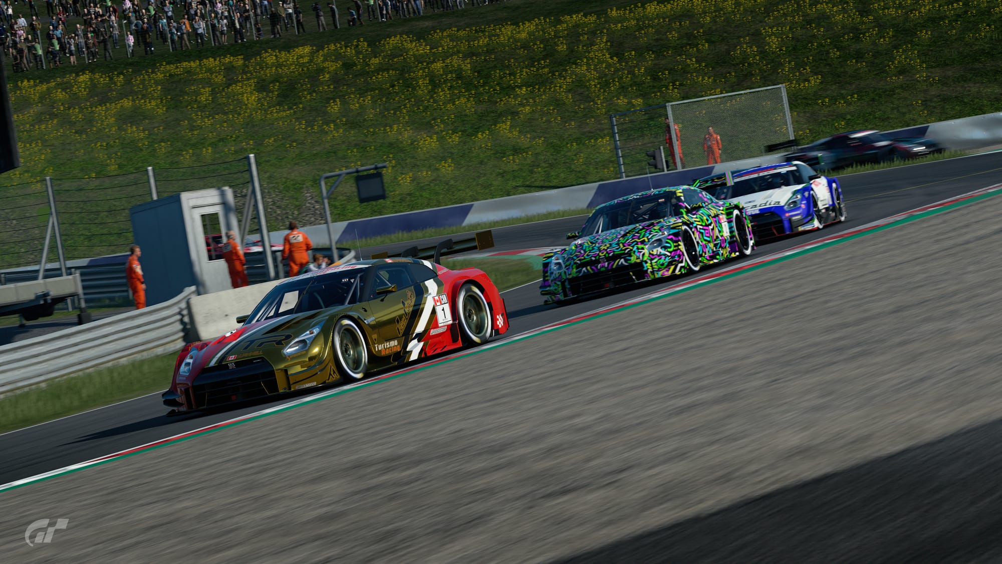 Three Nissan GTR Super GT cars exiting turn 3 at the Red Bull Ring, with a fourth in the background in the sand trap. This is a screenshot from Gran Turismo Sport.