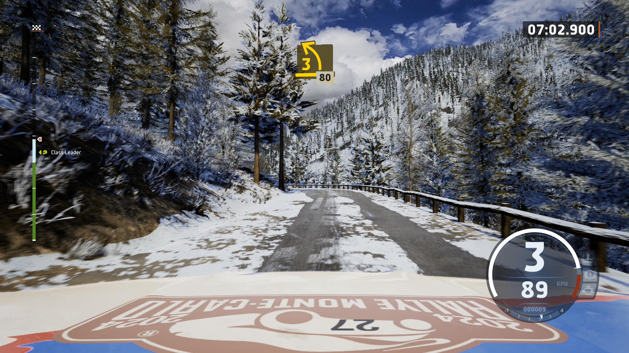 A screenshot of EA Sports WRC from the roofcam of a car in the middle of a snowy stage in Monte Carlo.