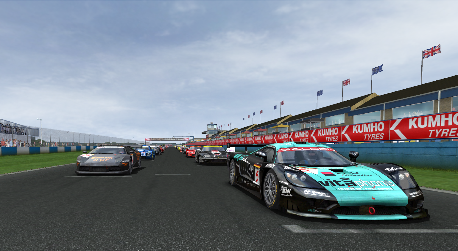 The starting grid for a race at Donnington Park in GTR2, with the black and teal Vitaphone Saleen S7-R and a black Lamborghini Murciealago R-GT on the front row.