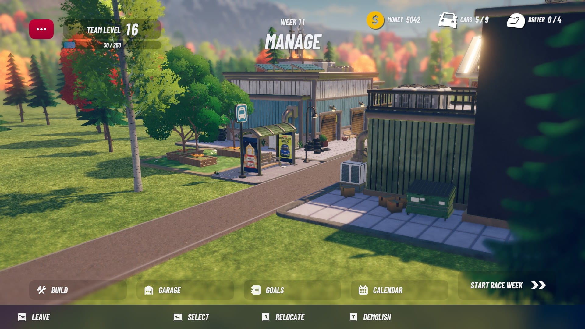 A look at your team campus between race weeks in iRacing Arcade. There are a couple workshops in fire, as well as a bus stop which has some advertising for Chocolate Milk on the side.