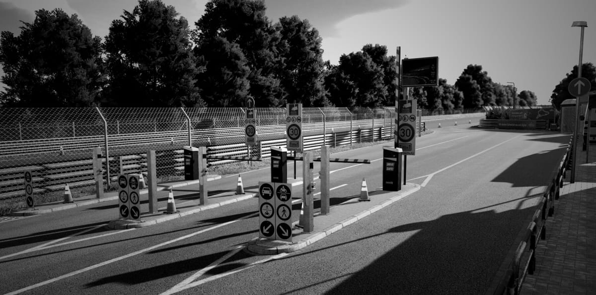 The entry gate to go onto the Nurburgring Nordschliefe, with the image being edited to be black and white. It is a screenshot from Assetto Corsa EVO.